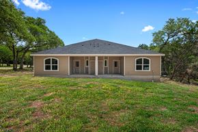 Spring Branch apartment for rent - the front of a house with grass and trees