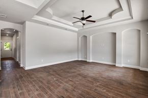 Spring Branch apartment for rent - the living room of a new home with a ceiling fan