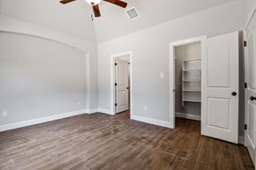 Spring Branch apartment for rent - the living room with wood flooring and white walls and a closet