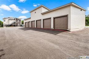 Spring Branch apartment for rent - a building with a row of garage doors