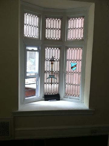 Philadelphia apartment for rent - a close up of a window with stained glass
