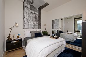 San Diego apartment for rent - a bedroom with a bed and a large window