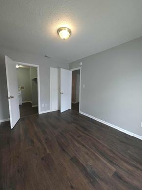 Hattiesburg apartment for rent - A room with a light on and wood flooring.
