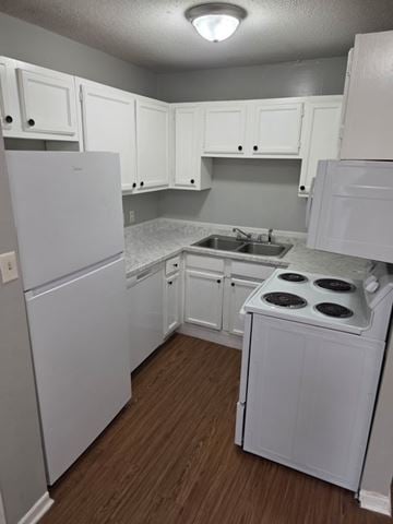 Hattiesburg apartment for rent - A small white kitchen with wood floors and white appliances.