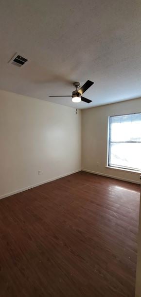 Hattiesburg apartment for rent - A room with a ceiling fan and a window.