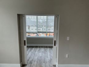 Hickory apartment for rent - an empty room with a large window and wooden floors