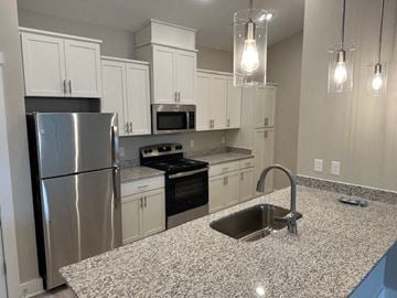 Hickory apartment for rent - a kitchen with stainless steel appliances and granite counter tops