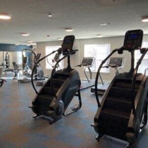 Hickory apartment for rent - a gym with some exercise equipment in it