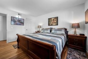 Nashville apartment for rent - A bedroom with a large bed and a painting on the wall.