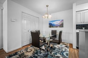 Nashville apartment for rent - A dining room with a glass table and chairs.