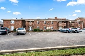 Nashville apartment for rent - A parking lot in front of a brick apartment building.