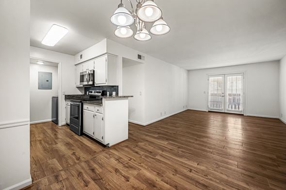 Nashville apartment for rent - A kitchen with white cabinets and a wooden floor.