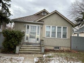 Prince Albert house for rent - the front of a house with snow on the ground