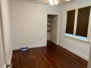 Prince Albert house for rent - a bedroom with a wood floor and a window and a closet