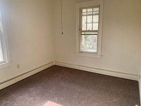 Allentown house for rent - an empty room with a window and a carpet