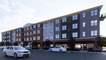 Royersford apartment for rent - Two cars are parked in front of a building with the name SIGNAGE on it.