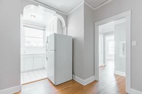 San Francisco apartment for rent - an empty room with a refrigerator in the middle of it