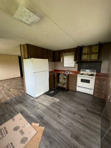 Boonville house for rent - A kitchen with a white fridge and a white oven.