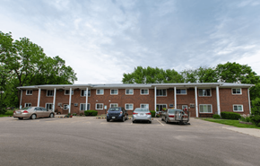 Oregon apartment for rent - an apartment building with cars parked in a parking lot