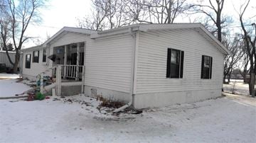 Grand Island apartment for rent - a small white house in the snow