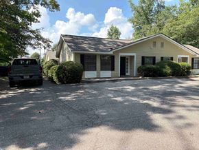 Newnan house for rent - A house with a car parked in front.