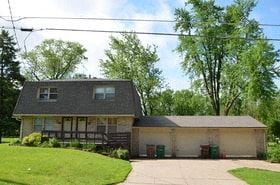 Windsor Heights house for rent - a white house with a gray roof and a driveway