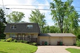 Windsor Heights house for rent - a white house with a gray roof and a driveway