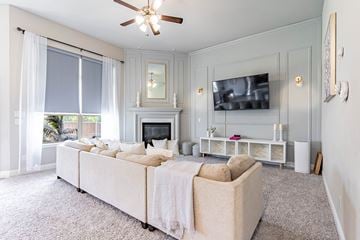 Forney house for rent - a living room with a large couch and a fireplace