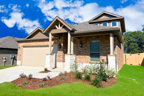 Terrell apartment for rent - A house with a brown roof and a garage door.