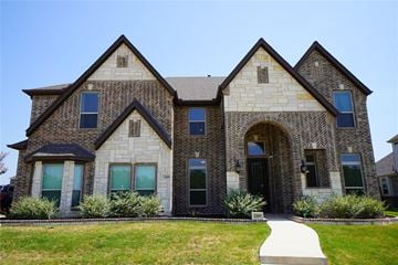 Forney house for rent - a large brick house with a sidewalk in front of it