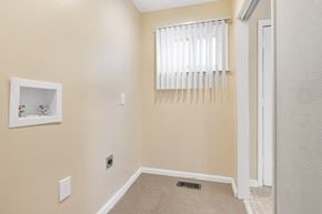 Cleveland house for rent - a room with a window and a door and a carpet