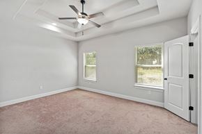 Spring Branch apartment for rent - an empty bedroom with a ceiling fan and window