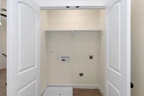 Hondo house for rent - a room with a white wall and a white tub and a closet