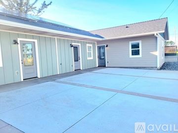 Crescent City apartment for rent - A house with a grey roof and a white door is available for rent.