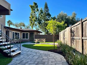 Oceanside apartment for rent - a patio with a picnic table in a backyard
