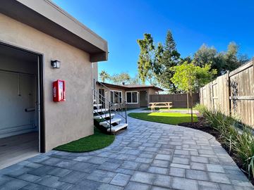 Oceanside apartment for rent - a patio with a fire hydrant on the side of a building