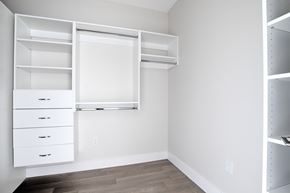 Nyack apartment for rent - A white closet with drawers and shelves.