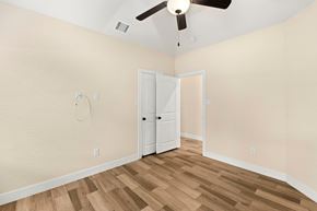 Spring Branch apartment for rent - an empty bedroom with a ceiling fan and a closet