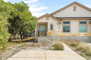 Spring Branch apartment for rent - the front of a house with trees and a sidewalk