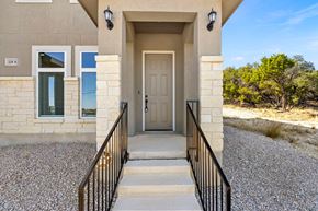 Spring Branch apartment for rent - the entrance to a building with a white door and stairs