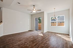 San Antonio apartment for rent - an empty living room with wood flooring and a ceiling fan