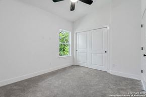 San Antonio apartment for rent - an empty room with a ceiling fan and a window