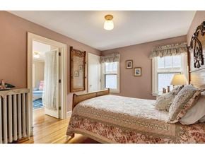 Minneapolis house for rent - a bedroom with a bed and a door to a bathroom