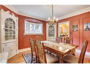 Minneapolis house for rent - a dining room with a wooden table and chairs