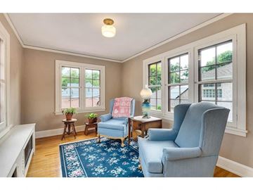 Minneapolis house for rent - a living room with two blue chairs and a rug