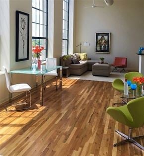 Hartford apartment for rent - A living room with a glass table and a green chair.