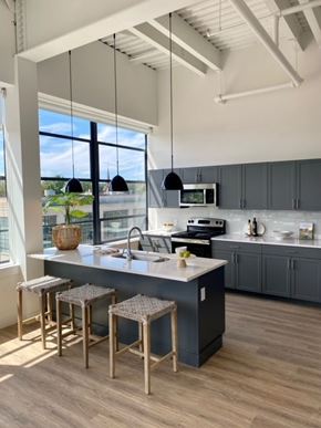 Hartford apartment for rent - A kitchen with a large island and bar stools.