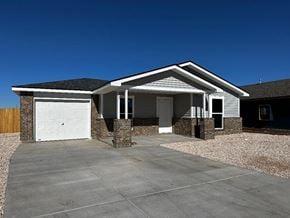 Odessa house for rent - a house with a driveway and a white garage door
