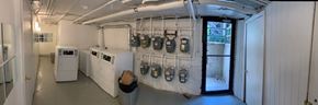 Chicago apartment for rent - A long hallway with a series of electrical boxes on the wall.