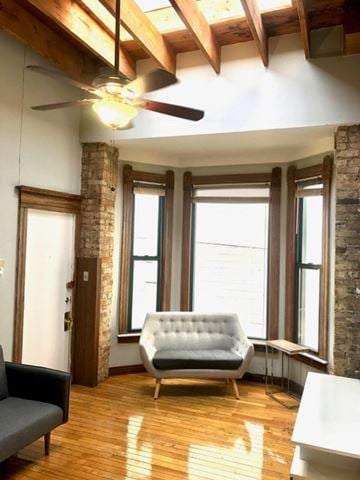 Chicago apartment for rent - A living room with a white couch and a grey chair.